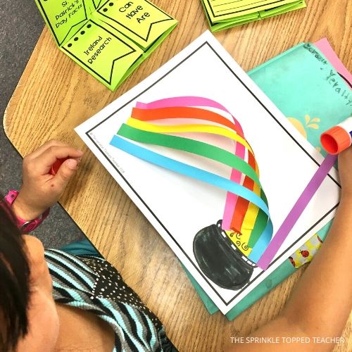 Student working on St. Patrick's Day rainbow craft.