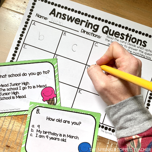 student completing answering questions in complete sentences game