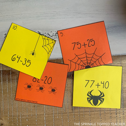 Halloween scoot game with math problems for addition and subtraction