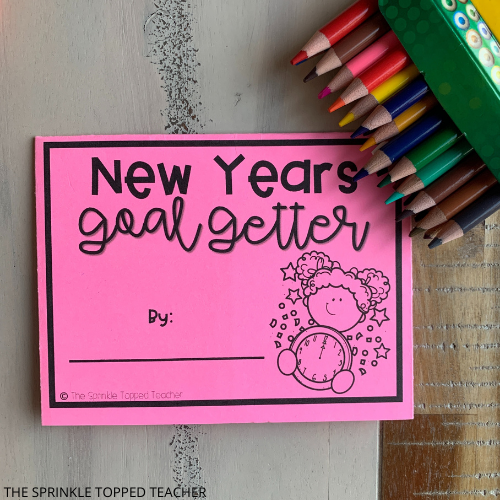New Years activity for students with colored pencils and pink piece of paper