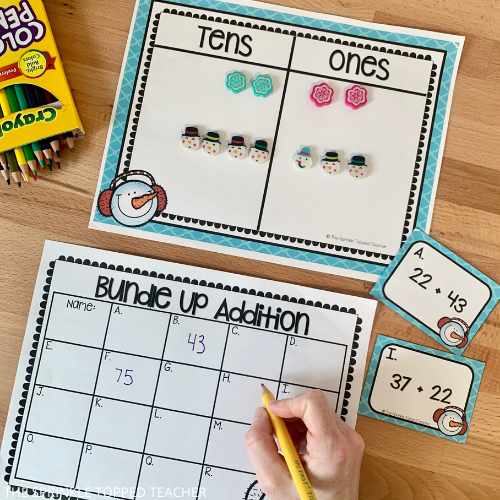 two digit addition scoot game with snowman themed worksheets