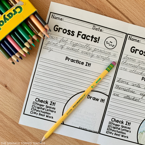 cursive handwriting worksheet with colored pencils and pencil