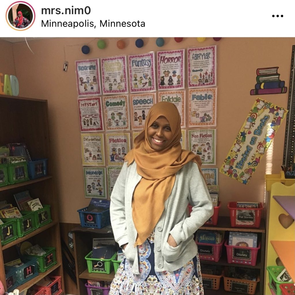 Teacher standing in front of classroom library @mrs.nim0