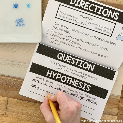 Student working on snow science experiments for kids notebook