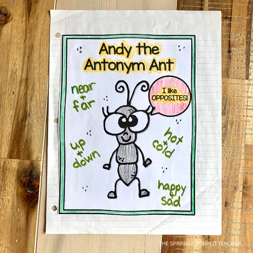 Ant with antonym worksheet in notebook