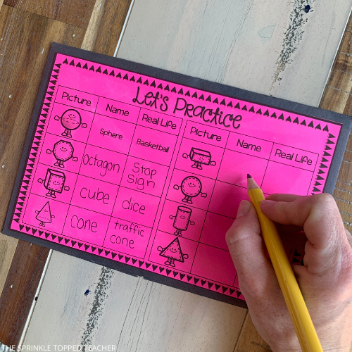 This is an image of a pink half page where students practice naming shapes and identifying real life shapes that match. There are 2D and 3D shapes to practice second grade geometry.
