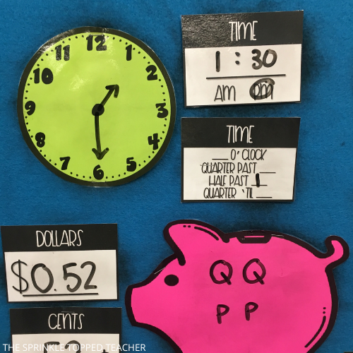This image shows the time and money section of the Math Masterminds 2nd grade warmups. The clock is green and the piggy bank is pink.
