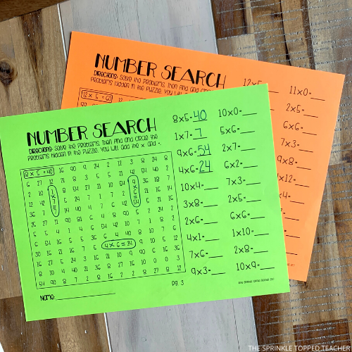 Examples of number search puzzles being completed on green and orange paper.
