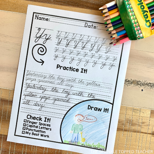 A student works on a cursive handwriting worksheet featuring the letter Y using a number two pencil. The have used colored pencils to color a picture to match.