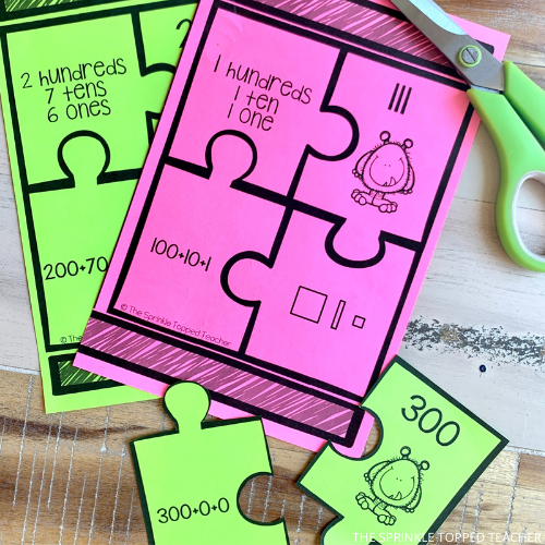 Use these place value activities to help students with their math skills. Here students are practicing hundreds, tens and ones.