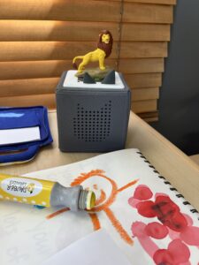 Lion King tonies and child's painting of a person